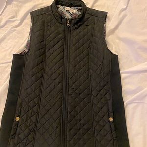 Women’s medium black Kim Rogers vest.